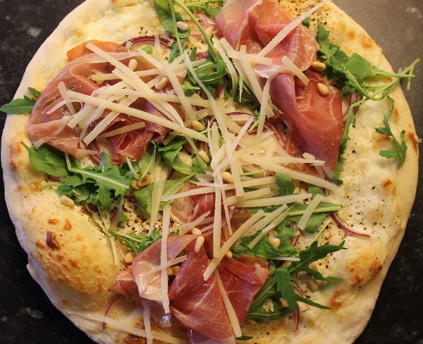 Pizza “Bianco” with goat cream cheese, arugula & Parma ham